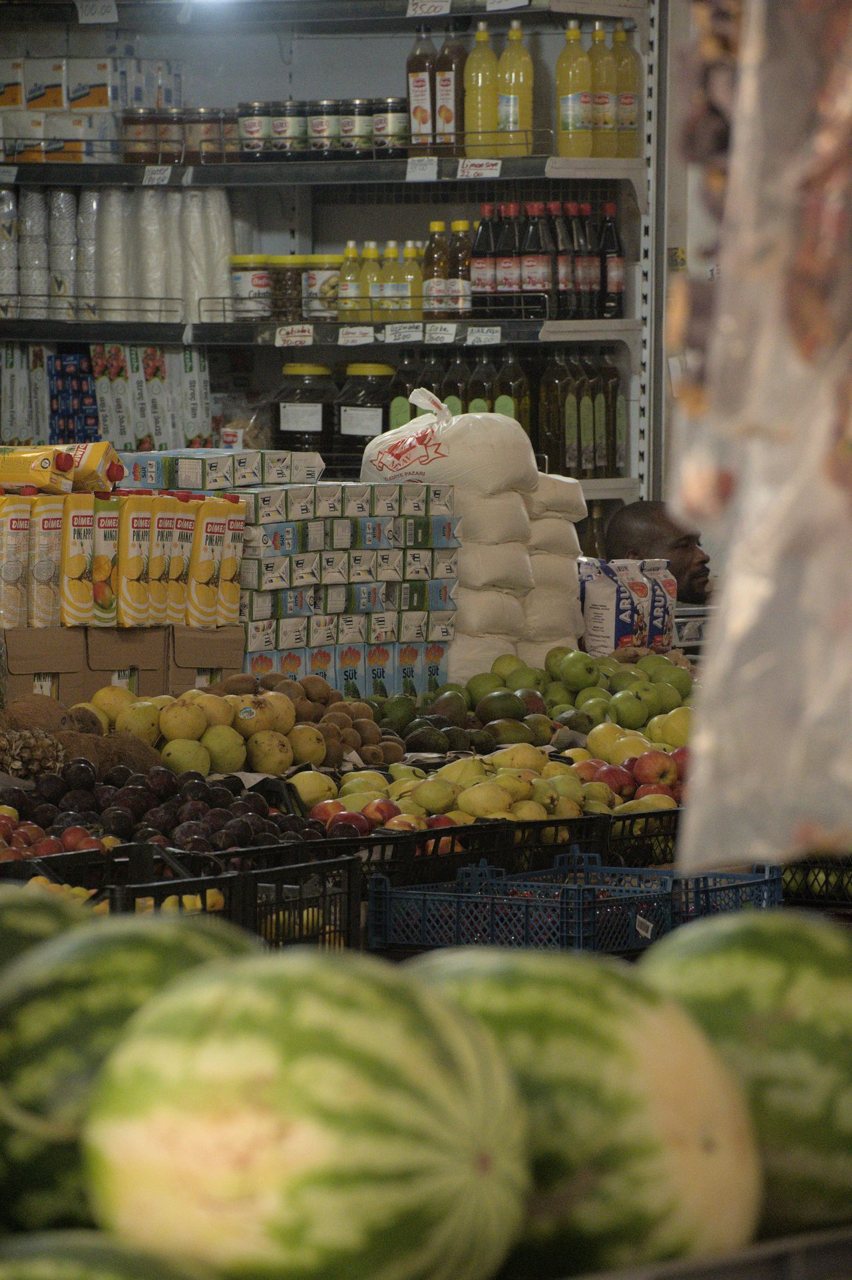 Free Variety of fresh fruits and products displayed in a grocery store aisle with clear copyspace. Stock Photo