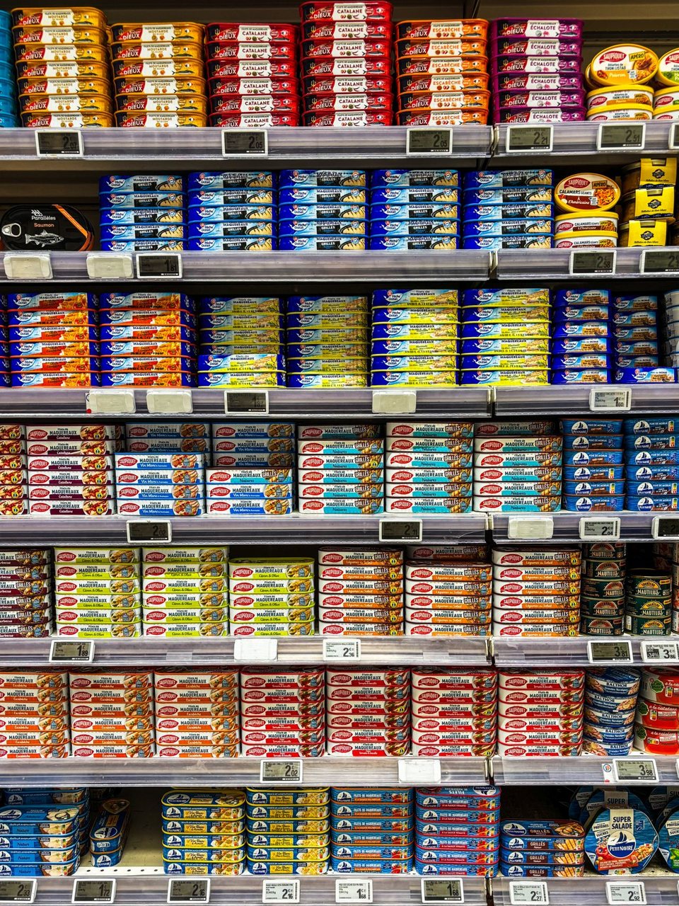 Free Vibrant assortment of canned foods on supermarket shelves in Pons, Nouvelle-Aquitaine, France. Stock Photo